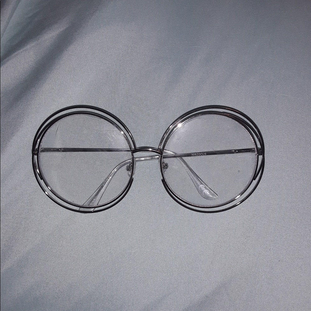 Rounded plastic non prescription glasses.